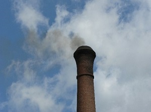 smokestack emitting smoke into the air