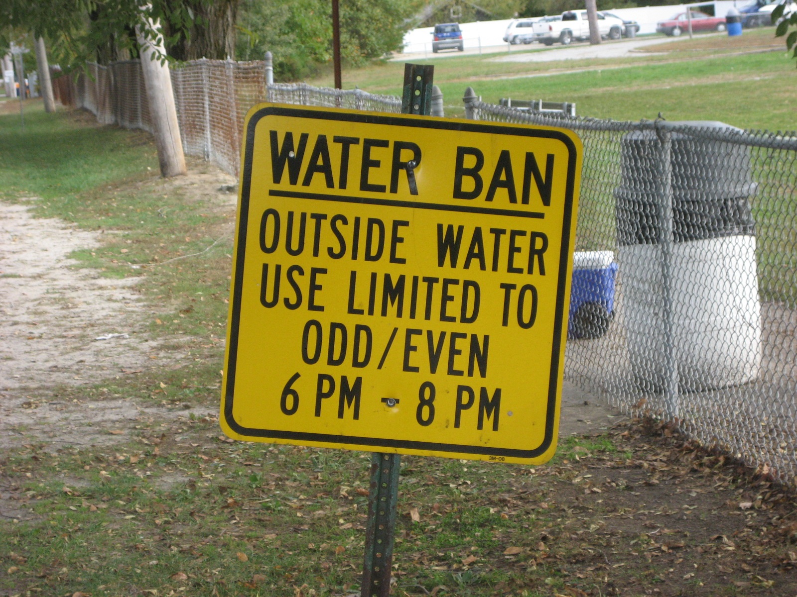 a sign notifies residents to an outdoor water use ban