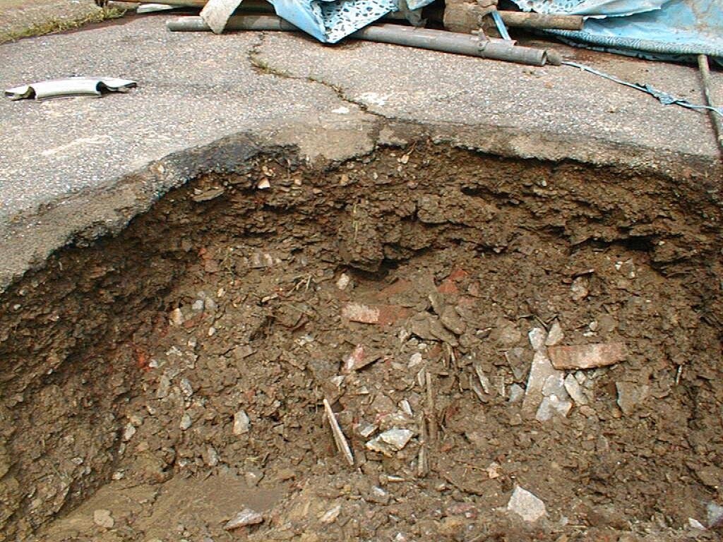 road excavation with exposed asbestos waste