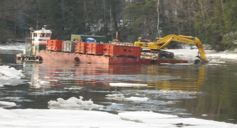 mechanical dredging from a barge in the Cocheco River