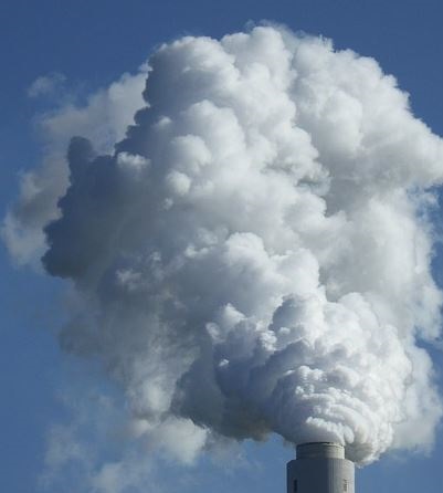smoke rises from a smoke stack