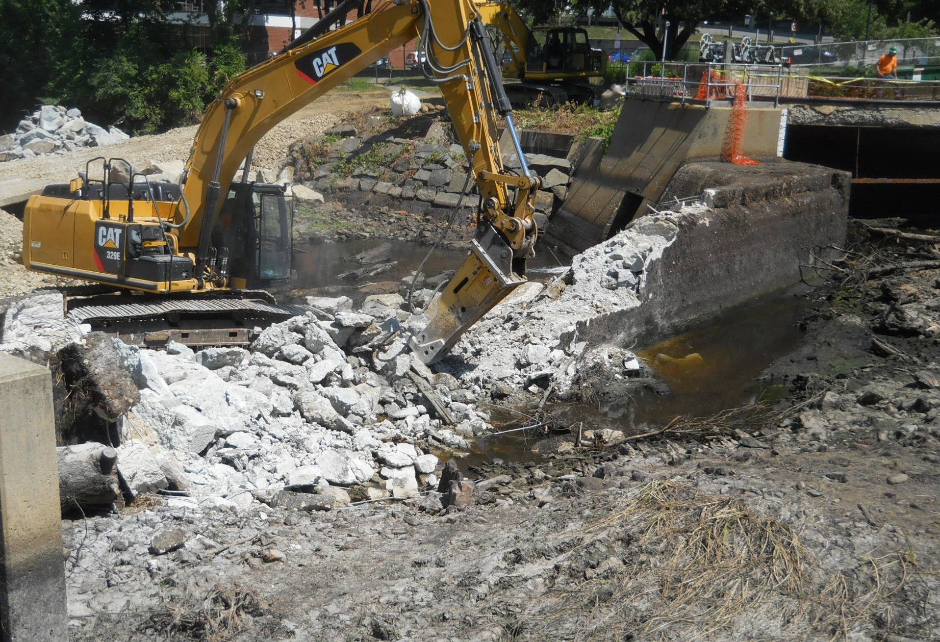 excavator removing great dam in exeter.