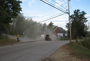 Road work causes dust to fill the air.