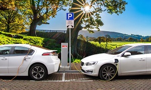 Two Electric Vehicles Charging at a Charging Station