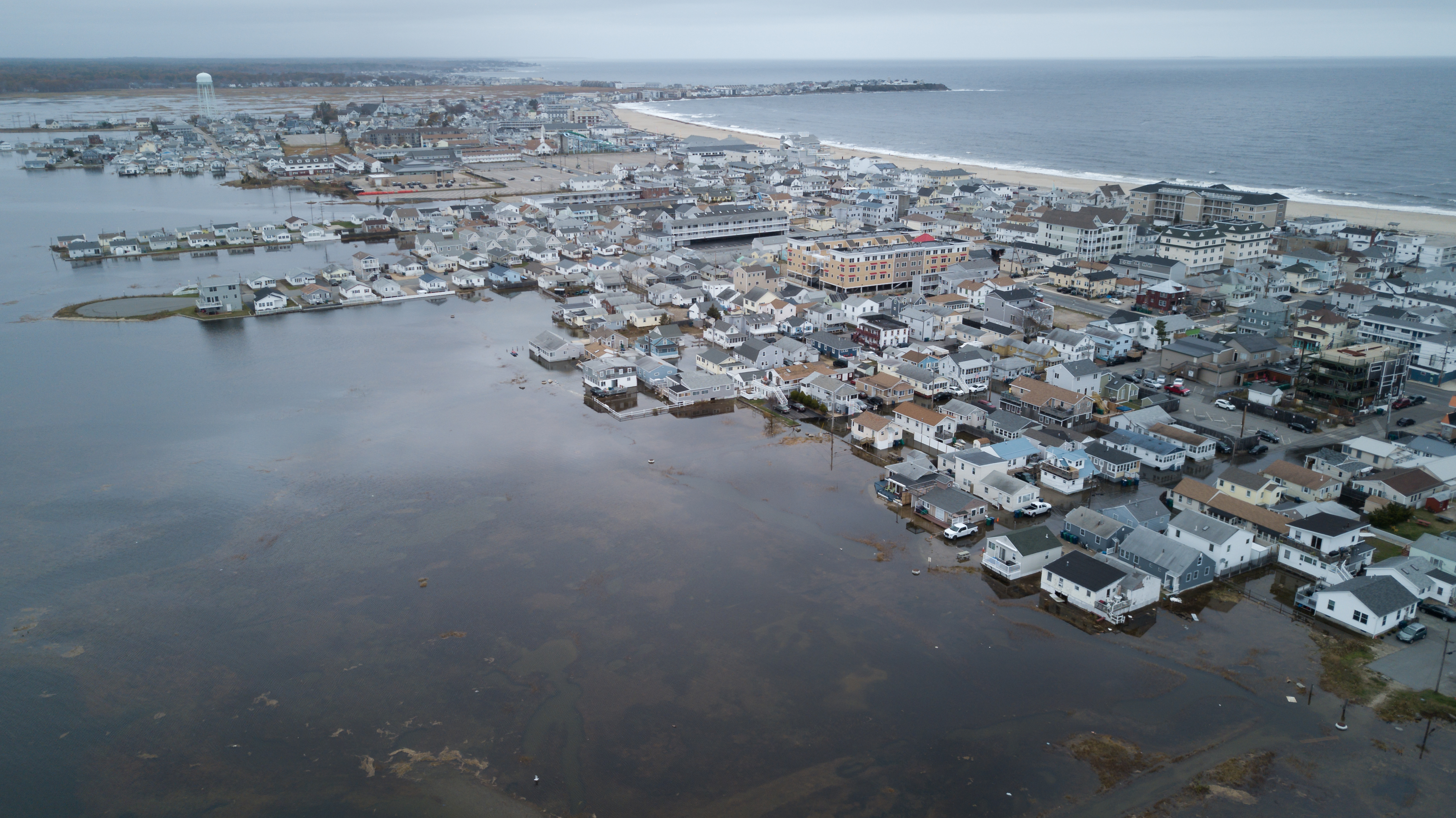 aerial photo of coastal flooding in the streets and around homes  Include photo credit: Will Brown 