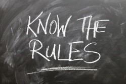 image of blackboard with “Know the Rules” written in chalk