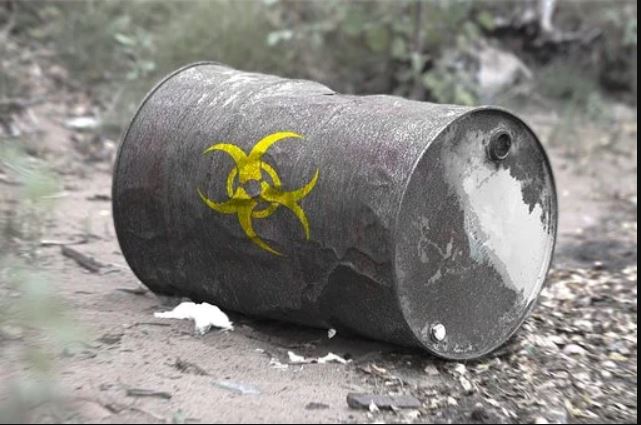 a knocked over barrel of hazardous waste