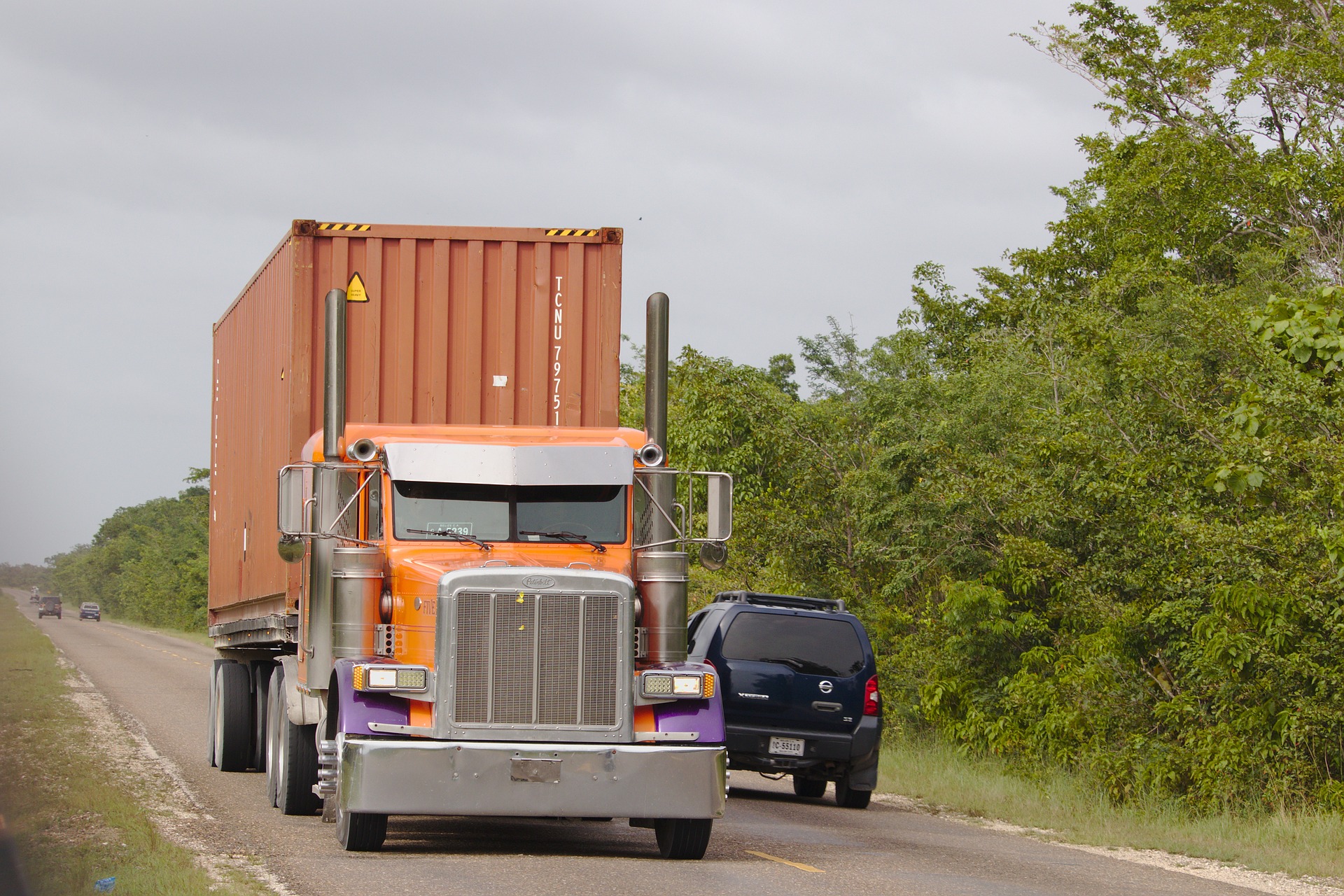 an image of an 18-wheeler truck on a highway