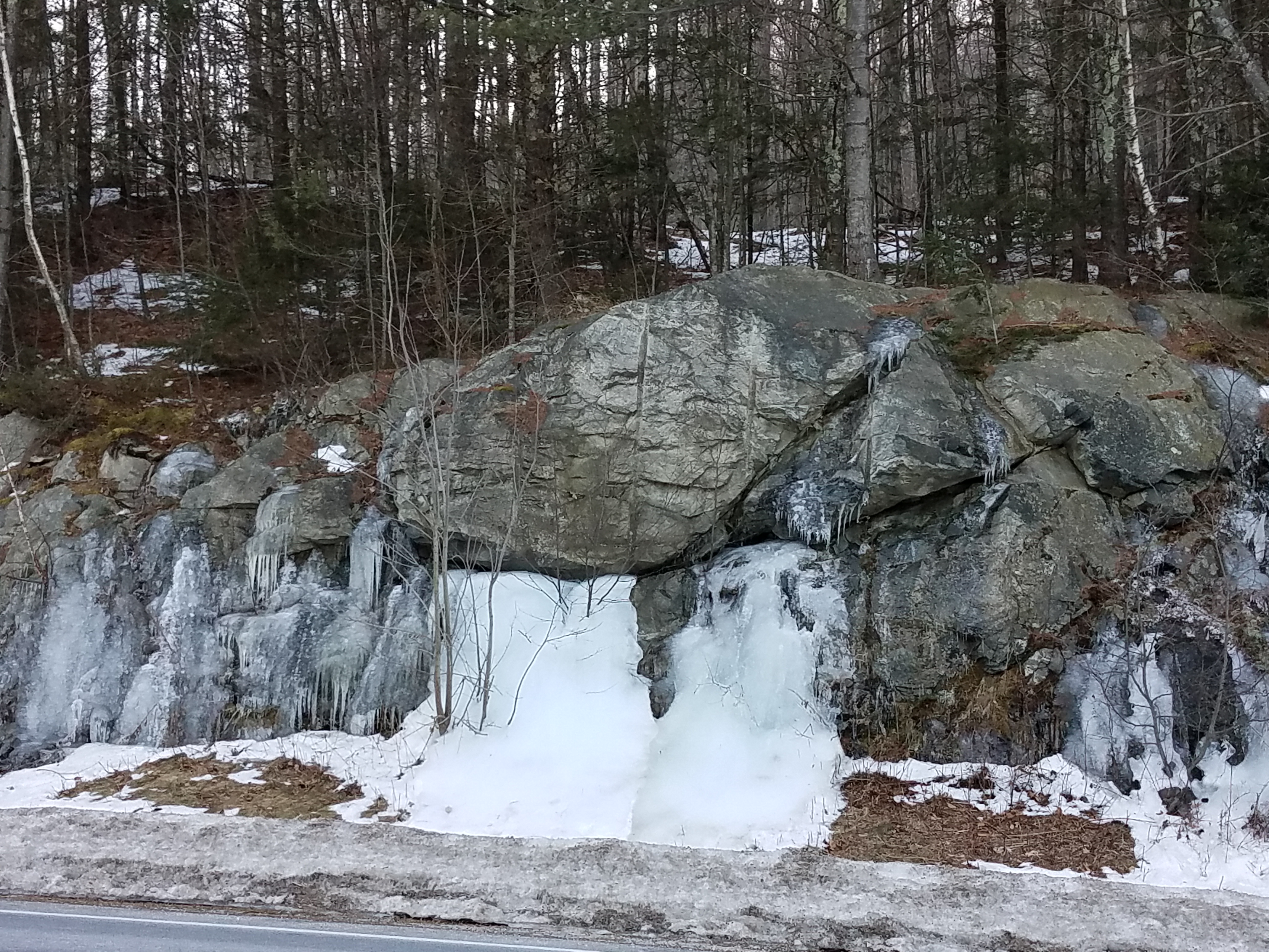 Groundwater seeps through rock formations and freezes in the winter.