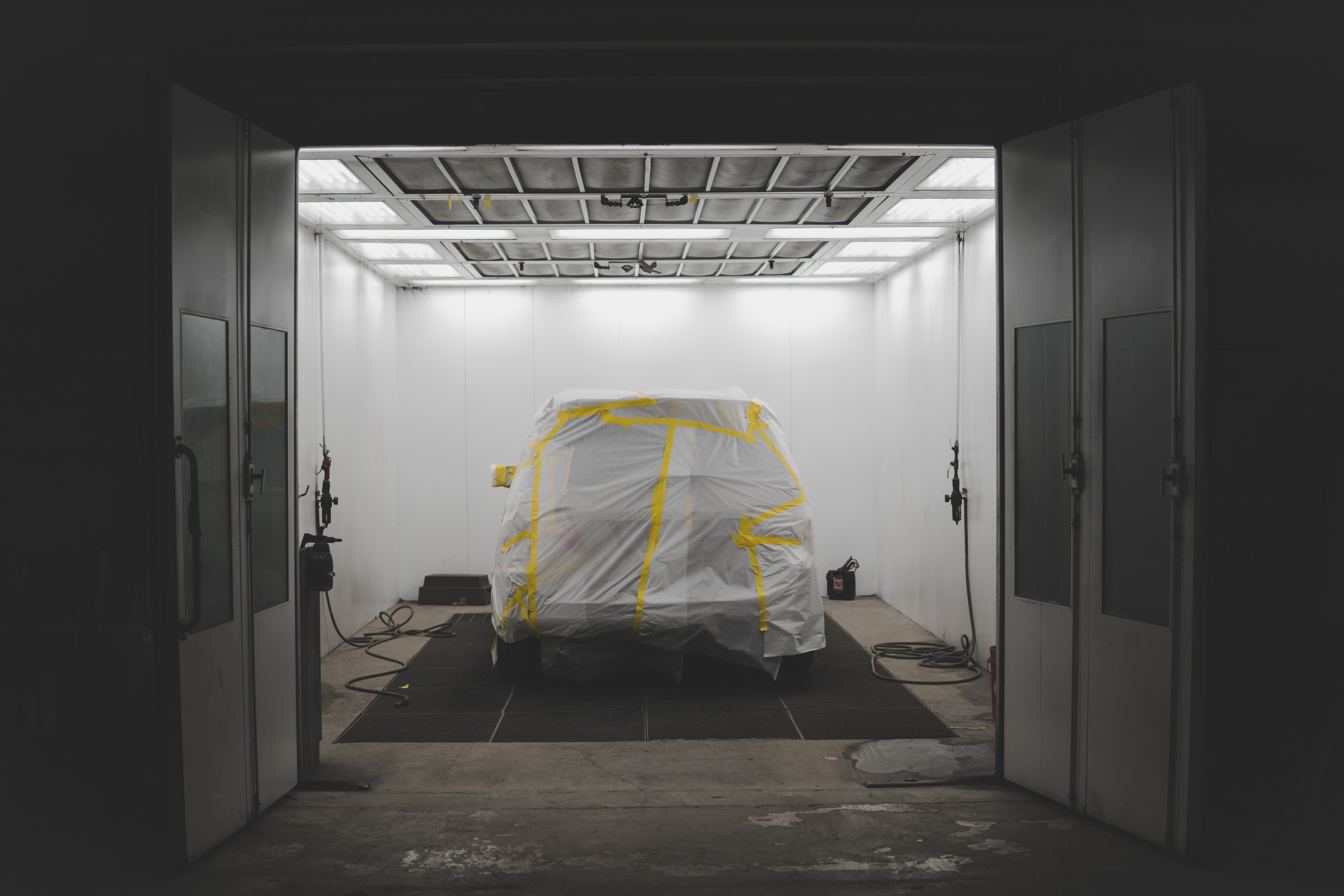 Automobile inside a spray booth