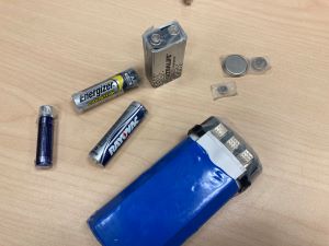 different types of batteries, all with clear tape on both ends