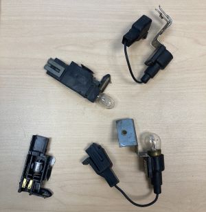 four, small, black mercury-containing tilt switches