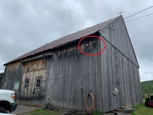 a barn with an air monitor on it, circled in red