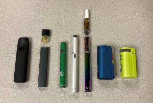 different vape devices that are partially disassembled
