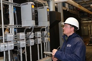 an inspector visually inspecting a boiler