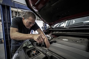 image of a technician working on a vehicle