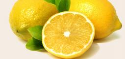 three lemons with a white background