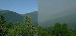  side-by-side comparison of a mountain view with clean air and hazy air 