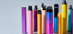 multiple types of vaping devices in an assortment of bright colors