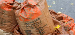large brown paper bags filled with leaves