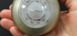 silver thermostat with a dial