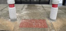 Store entrance with too much salt scattered on the concrete.