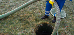 hose pumping out a household septic tank